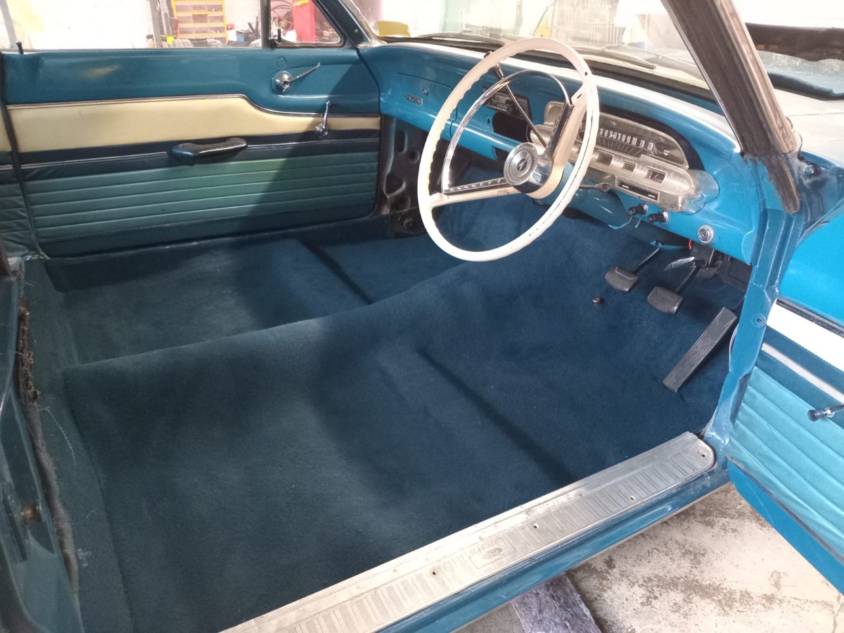 Classic Ford Falcon after — fresh dark blue carpet replacing the worn original, colour matched to the cabin